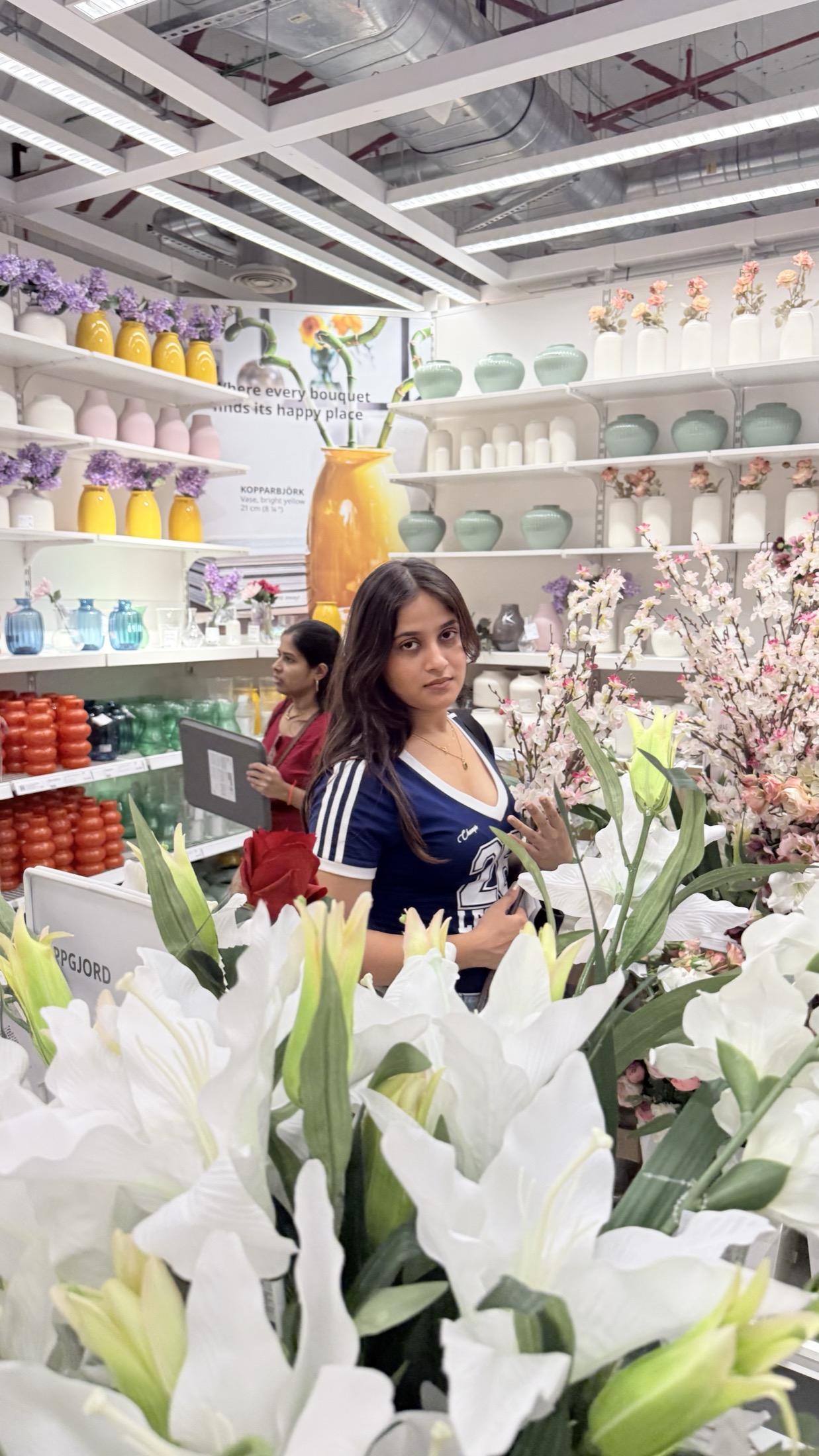 Among flowers and colorful vases