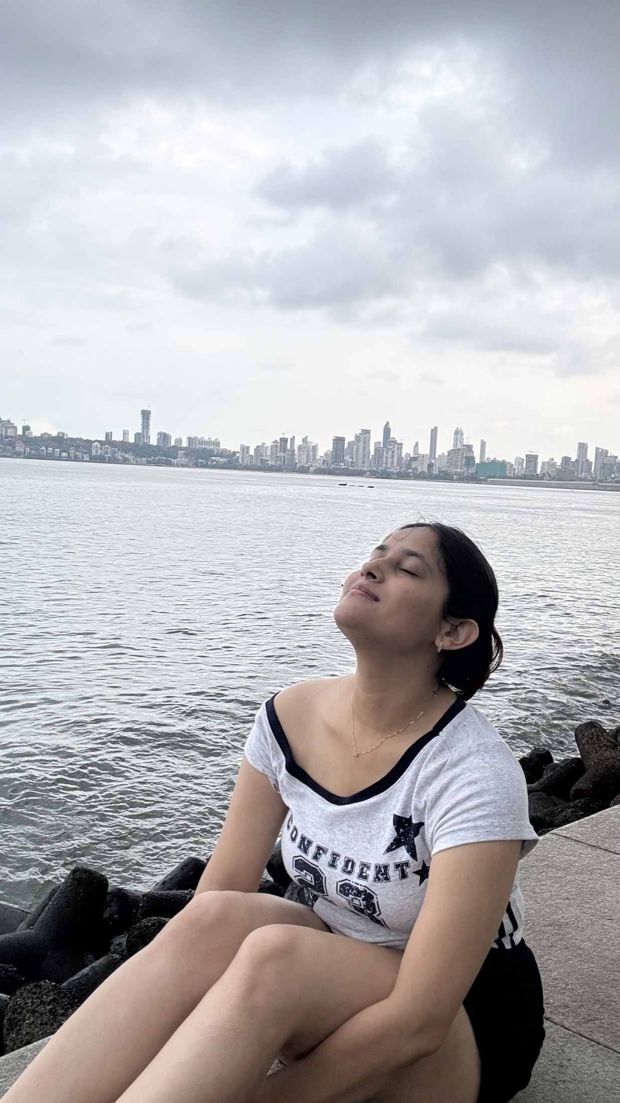 Eyes closed by the sea