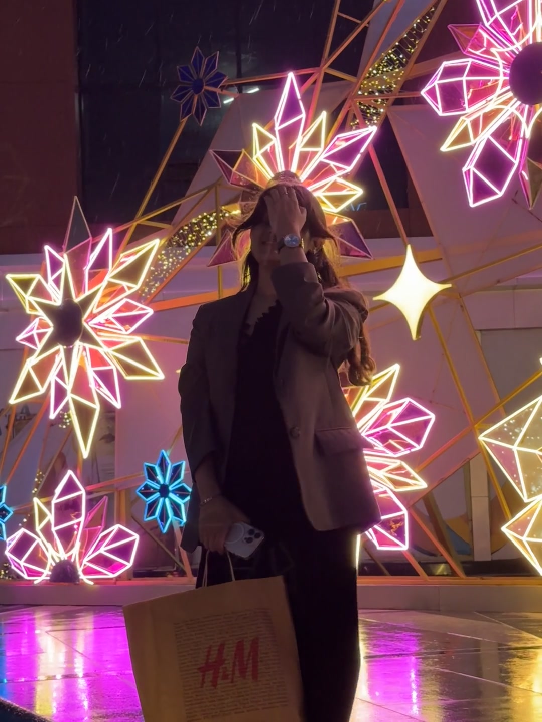 Neon lights and shopping bag at night